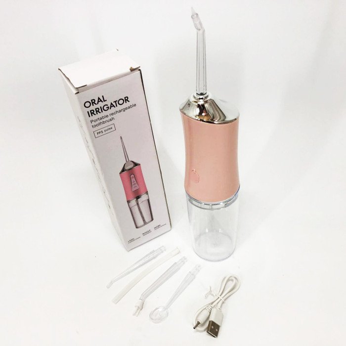 Іригатор для чищення зубів та порожнини рота Oral Irrigator з акумулятором та змінними насадками. Колір: рожевий